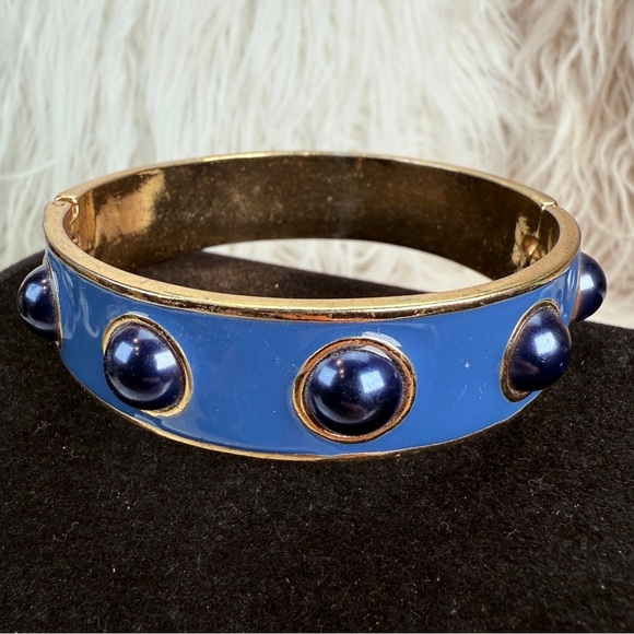 We Vintage goldtone, black and blue weighted hinged costume bangle bracelet